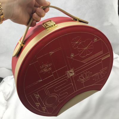 China Recycled Luxury Advent Calendar Custom Cosmetics Carrying Christmas Case Metal Handle Round PU Materials Suitcase for sale