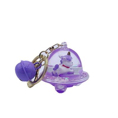 China Fashionable Unicorn Spaceship Shape Keychain Floating Liquid Key Chain Backpack Couples Pendant Gift for sale