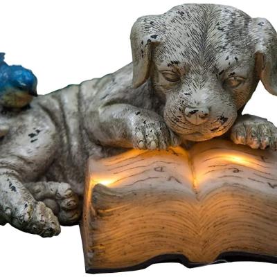 China Europe Resin Solar Power Handmade Instructional Outdoor Statuary Dog Read A Book Garden Gnome Decoration for sale