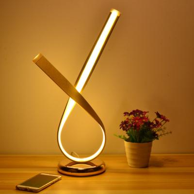 China Nodic modern bedroom led table lamp hot dropshipping aluminum amazon ebay minimal twist desk light gold aluminum for sale