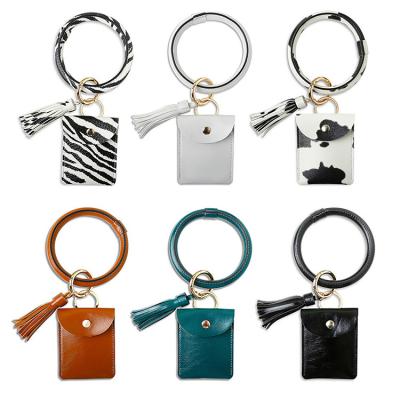 China Amazon Hot Selling Amazon Coin Holder or Change Keychain Leather Key Ring Bracelet Gift Loose Around Key Chain for Women Girls with Fashion Tassel for sale