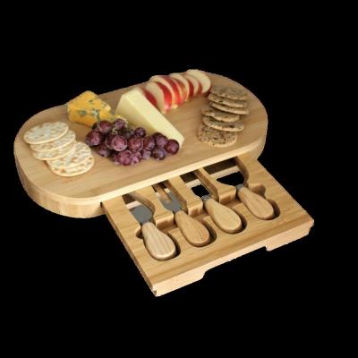 China Sustainable Hot Selling Eco Friendly Bamboo Cheese Board And Knife Set Bamboo Cheese Cutting Board With Cutlery Drawers for sale