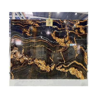 China Fusion Modern Exotic Black Gold Granite Stone Slabs Price for sale