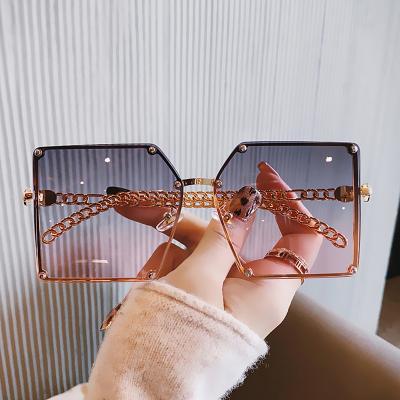 China Fashion Sunglasses Shape Insist Frameless Sunglasses Big Square Frame Summer Travel Cavity Sunglasses for sale