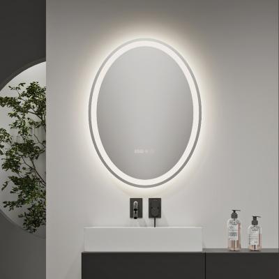 China Simple Waterproof Oval Shape Bathroom Three-tone Style Magnifying Fogproof Smart Touch Screen Illuminated LED Light Mirror for sale