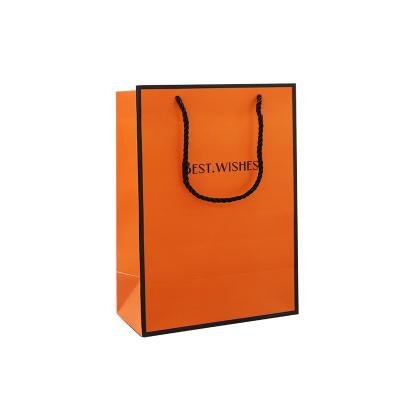 China Handmade Orange large gift bag cosmetics packaging bag clothing thickened white cardboard handbag for sale