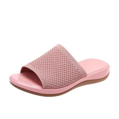 China Breathable 2022 new spring and summer fly weave polyurethane sole leisure trade large size beach shoes flat one-word slipper female for sale