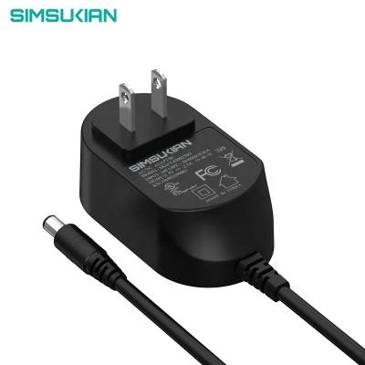 China Industrial Universal Power Adapter Wall Mount Adapter 12v 1a Universal Travel Plug for sale