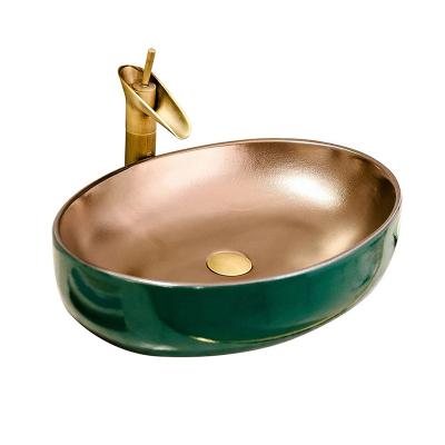 China Sink Art Basin Wash Basin, Oval Metal Color Bathroom Ceramic Bowl Shaped Bathroom Furniture Toilet Bathroom Sink for sale