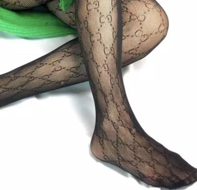 China Breathable custom logo letter stocking gg hosiery flocking printing thigh high sock contrast color stockings for women for sale