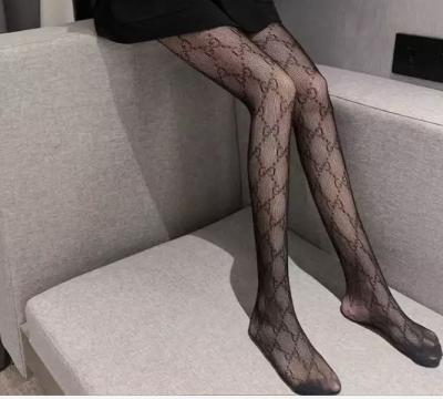 China 2022 new Paris fashion brand alphabet antibacterial stockings autumn and winter ultra-thin anti-shaving slim sexy slim printed pantyhose for sale