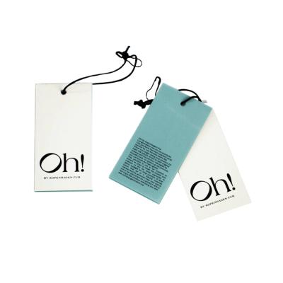 China Apparel Hang Tag Customized 800g Coated Paper Craft Garment Clothing Business Card UV Hang Tag for sale