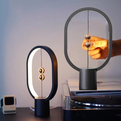 China USB Touch Control Mini Levitation Balance LED Table Lamp Between Heaven and Earth Ellipse Lamp Modern Rechargeable Magnetic Bedside Switch Night Light for sale