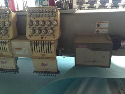 China Portable Electronic SWF Commercial Embroidery Machine Support 12 Languages for sale