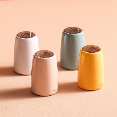 China Sustainable Household Toothpick Dispenser Holder Desktop Organizer Plastic Press Toothpick Storage Bottle for sale