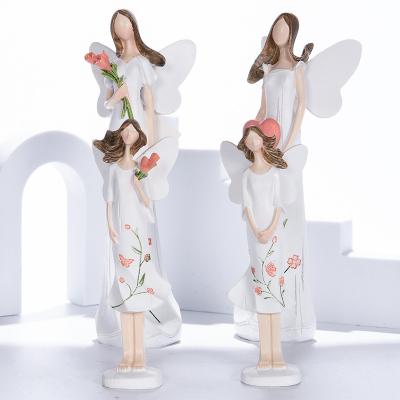 China Wholesale White Pink Heart Angel Figurine Home Decor Statue Resin Angel Figurines Crafts From Europe Abigail Factory for sale