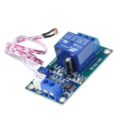 China XH-M131 DC 5V 12V control switch photoresistor relay module detection sensor 10A automatic brightness sealed light module for sale