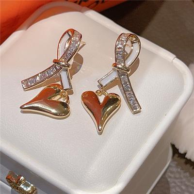 China Tasty Design 18K 925 Bow Needle Silver Nickel Free Knot Jewelry Gold Plated Heart Stud Earrings For Women for sale