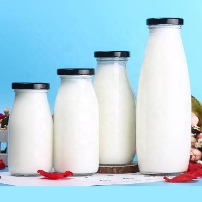 China Wholesale Round Glass Liquid Jar Liquid 200ml 300ml 900ml Water Milk Beverage Bottle With Lid Straw Glass Water Milk Bottle for sale