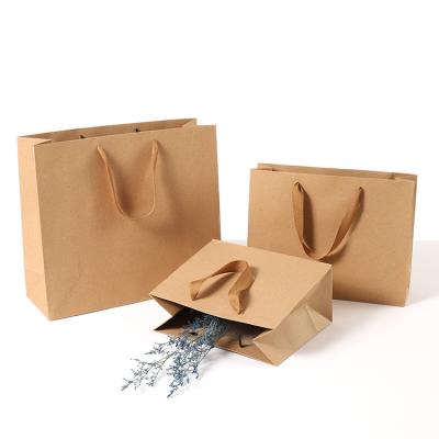 China Recycled Materials Customized High Quality Stand Up Pouch Craft Kraft Paper Pouches Gifts Packing Bag With Handle for sale