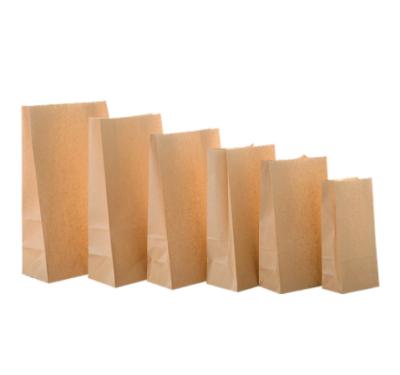 China Recycled Materials 50/100pcs/roll Food Thank You Gift Craft Kraft Paper Gift Packaging Bags for sale