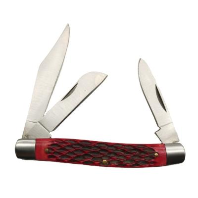 China 3R13c Slide Open Hunting Folding Pocket Knife With Red Carved Ox Bone Handle for sale