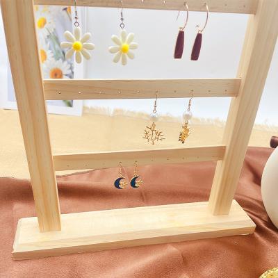 China Store Display Home Decoration Factory Hot Sales Earring Jewelry Rack Wooden Wall Mounted Boutique Display Rack New for sale