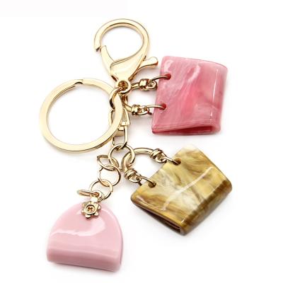 China 2020 Portable Wholesale Style Acrylic Bag Key Chain For Women Mottled Pattern Key Chain for sale