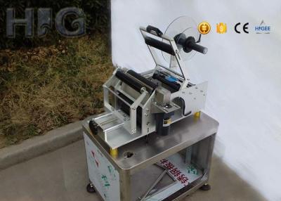 China Omron Detect Magic Eye Hand Semi Automatic Round Bottle Sticker Labelling Machine for sale