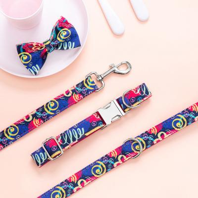 China Viable Personalized Hot Border Red Graffiti Amazon Pet Traction Rope Dog Leash and Collar Bow Link Set for sale