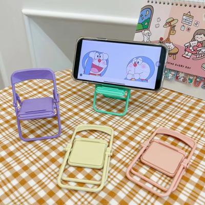 China Hot Selling Adjustable Small Chair Mobile Phone Holder Gift Plastic Folding Mobile Phone Holder for sale