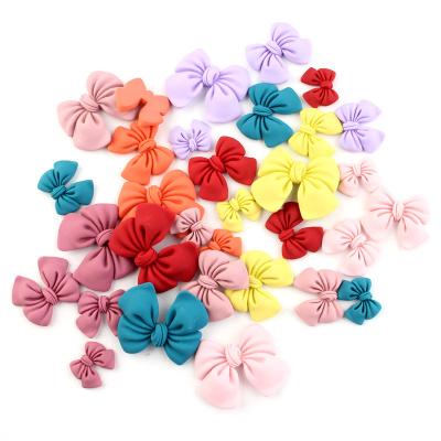 China Europe hot sale cute matte bowknot shape flatback resin cabochons for hair ornament for sale