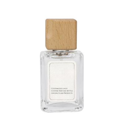 China Cosmetic Best selling square spray perfume glass bottle 50ml glass perfume bottle botol parfum luxury perfume bottle with wooden cap for sale