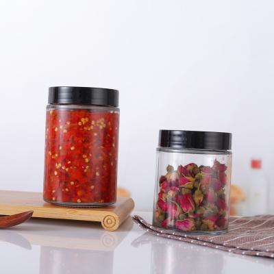 China Empty Freshness Preservation 100ml 180ml 280ml 380ml Kitchen Spice Storage Round Glass Jar Set For Honey With Black Lid for sale