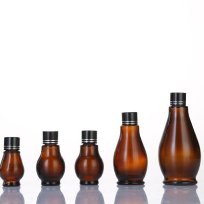 China Personal Care 10ml 20ml 30ml 50ml 100ml Brown Pumpkin Essential Oil Glass Bottle for sale