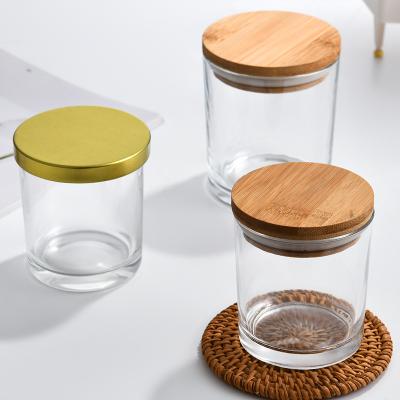 China Wholesale Home Decoration Clear And Black Frosted Glass Jars Empty Wide Mouth Candle Container With Wooden Lid In Bulk for sale