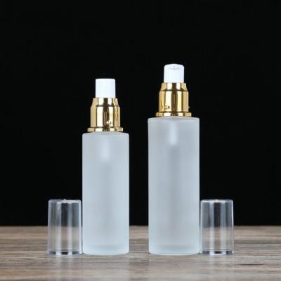 China Luxury Personal Care Cosmetic Skin Care Packaging Flat Shoulder Glass Bottle 20ml 30M 50ml White 100ml Pump Body Lotion Bottle for sale