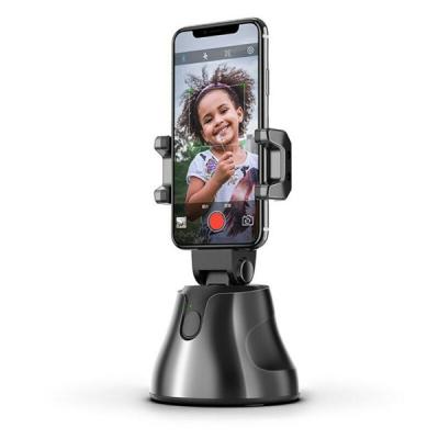 China 360 degree auto tracking plastic horizontal phone holder for table for sale