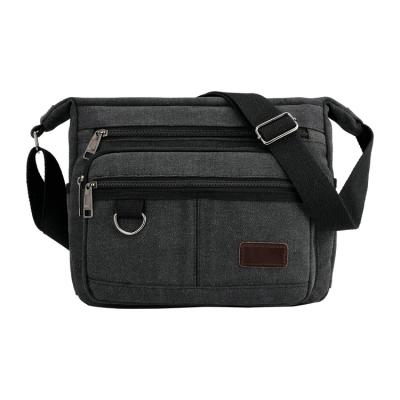 China Fashion Vintage High Quality Black Waxed Canvas Shoulder Cross Body Small Messenger Bag For Women Mens for sale