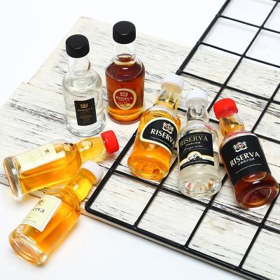 China 2oz 50ml Mini Glass Bottle Alcohol Glass Beverage Bottle Liquor Wine Whiskey Bottle With Screw Lid For Spirits for sale