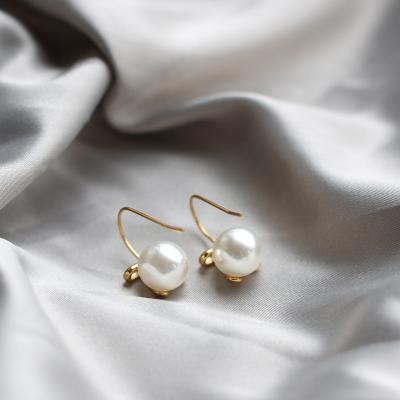 China CLASSIC Fashion 18k Gold Plated Bow Knot And White Color Pearl Earring Jewelry For Ladies for sale