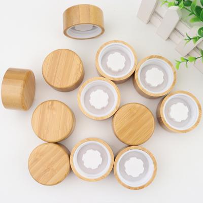 China Non Spill 2021 Natural Color Cosmetic Perfume Jar Bamboo Wooden Spray Lid for sale