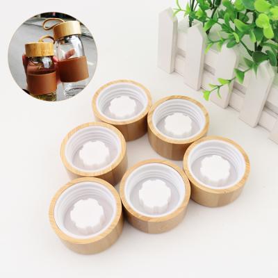 China Custom Perfume Jars Cosmetic Glass Jar Container Bamboo Wooden Lid for sale