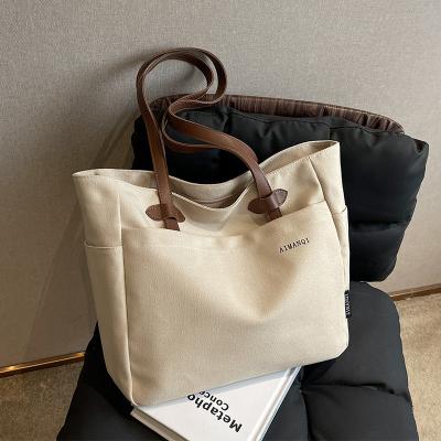 China New Vintage Portable Solid Canvas Bag Fashion Small One-Shoulder Handbag for sale