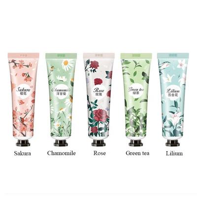 China Custom Wholesale Logo Peach Chamomile Hand Cream Tubes 30g Anti Aging Winter Hand Cream Lotion for sale