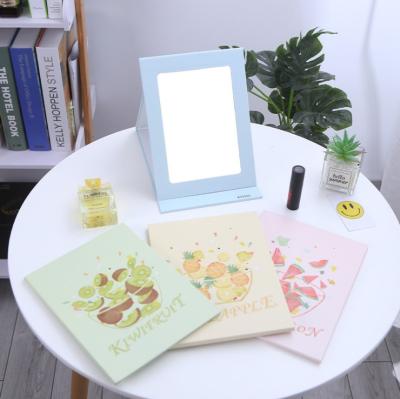 China New Creative Decorative Mirror Fruit Cartoon Unilateral Square Flip Up Makeup Dresser Folding Desktop Mirror for sale