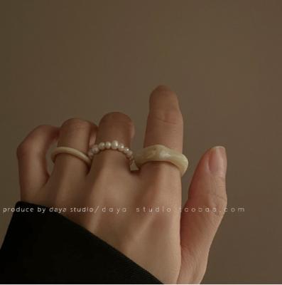 China FASHIONABLE Retro Wearing Wind Pearl Cold Ring Zooying Acrylic Ring Three Sets Stacked Woman Rings for sale