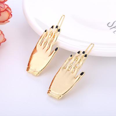 China Hot Selling Fashionable Jewelry Hair Styling Tools Adorn Accessories Women Gold Plated Alloy Hand Shaped Claw Clip Hairpin for sale