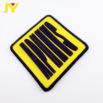 China Sustainable Clothing Backpack Shoes 3d Soft Rubber Patch PVC Silicone Label for sale