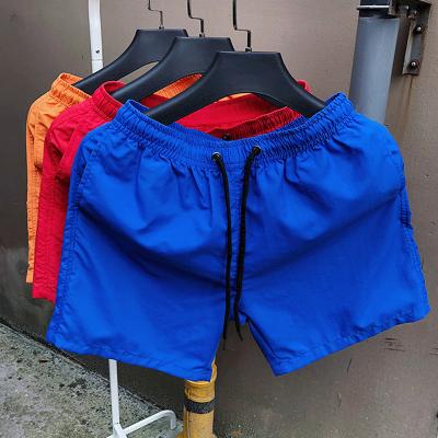 China Custom Summer Casual Mens Candy Colors Anti-wrinkle Wholesael Beach Running Workout Shorts Cargo Shorts for sale